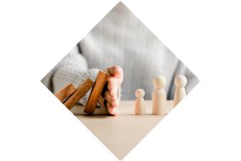 Health and Safety Image , Hand protecting dominos from falling